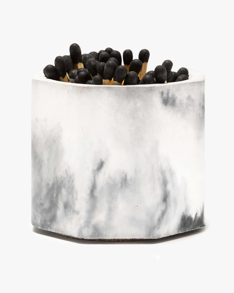 marble match holder with matches in it