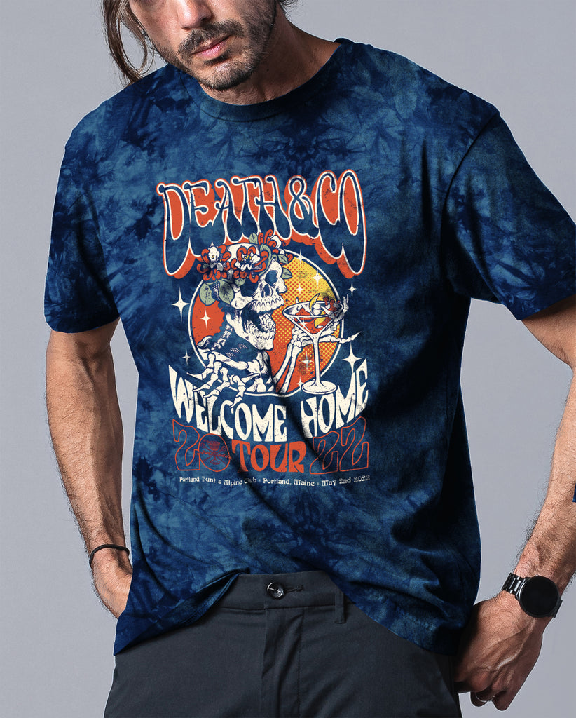 man wearing blue tie dye death & co. welcome home 2022 tour tee