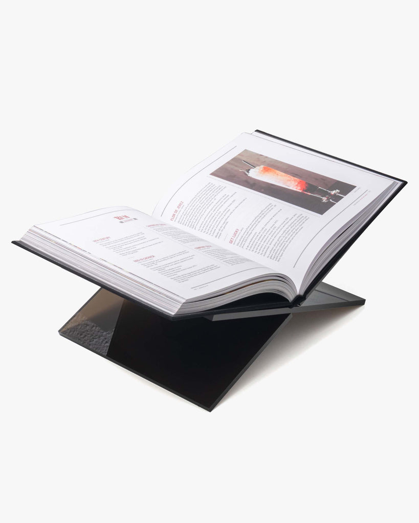 acrylic book stand with open book on it
