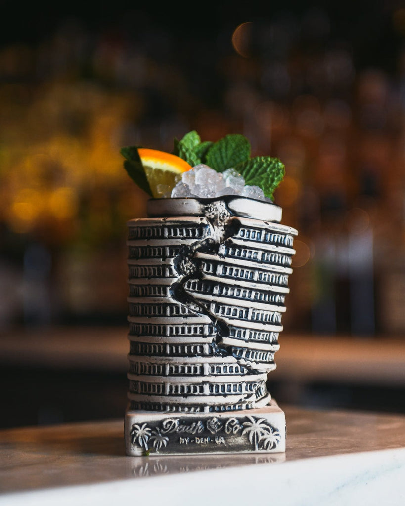 capital record quake mug with ice, orange, and leaves coming out of the top