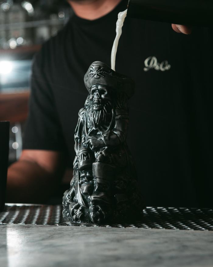 silver pirate mug on bar top