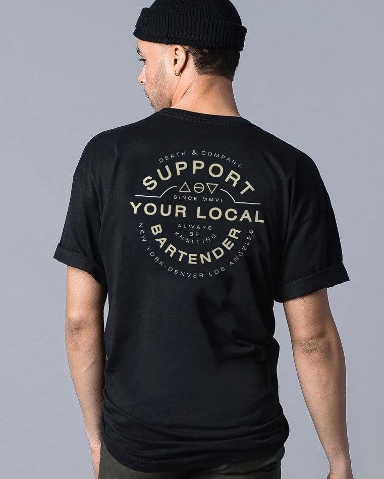 back of man wearing "support your local bartender" black t-shirt 