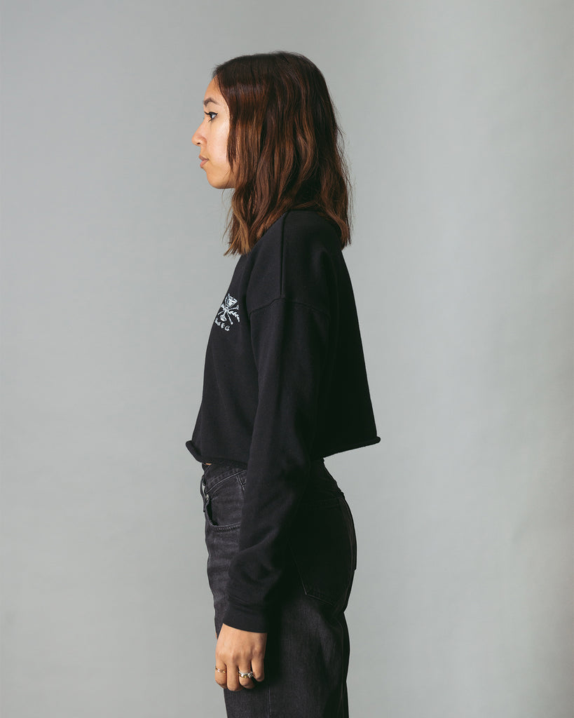 side of cropped black crewneck on woman