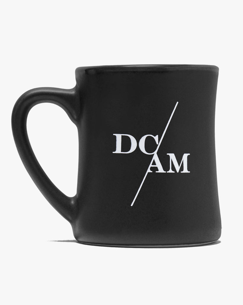 black matte mug with DC/AM on it