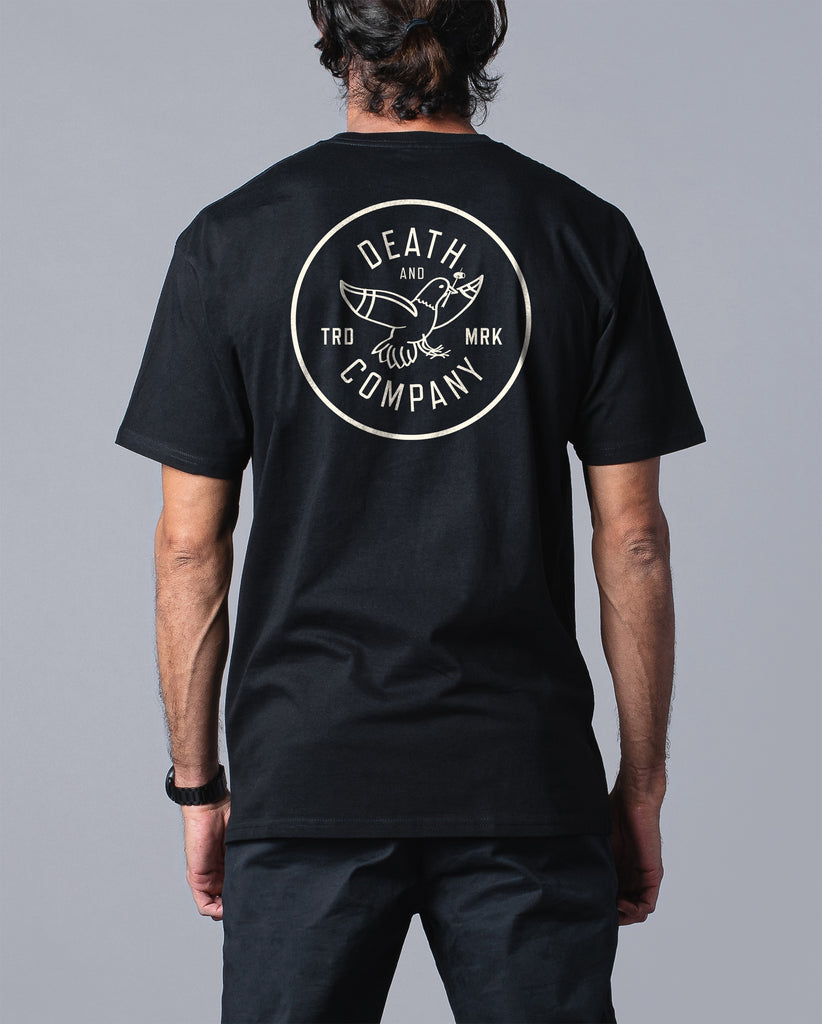 back of man wearing death & company black tee with pigeon graphic 