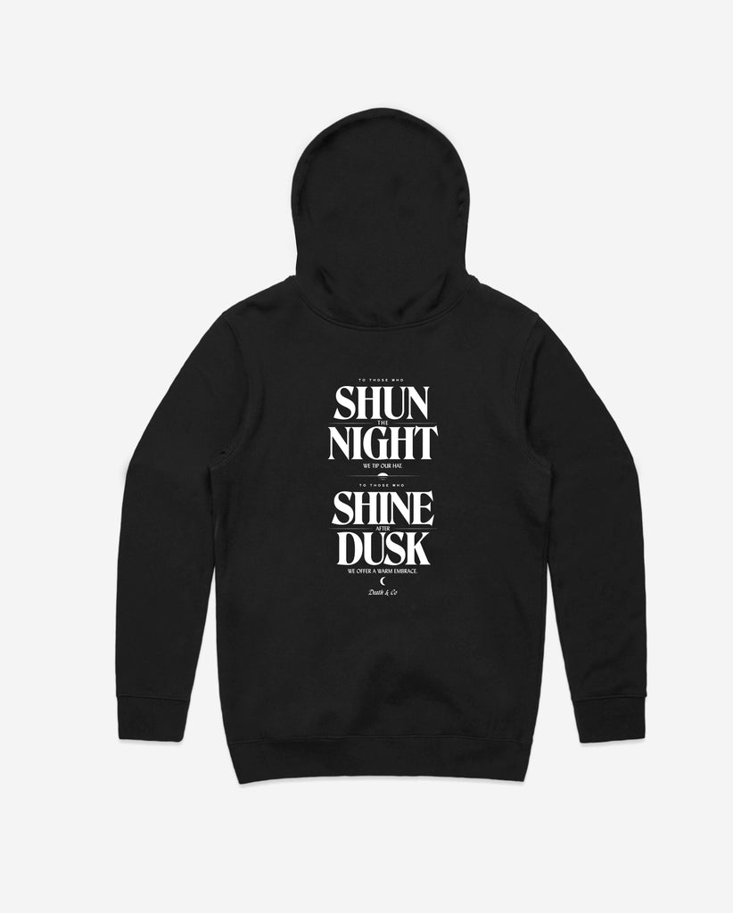 back of black hoodie with "to those who shun the night we tip our hat. To those who shine after dusk we offer a warm embrace"